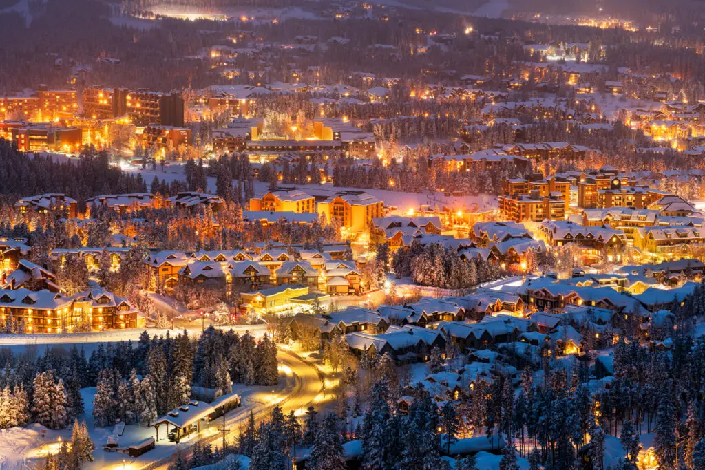 Breckenridge Colorado USA town skyline and cabins in winter at dusk.