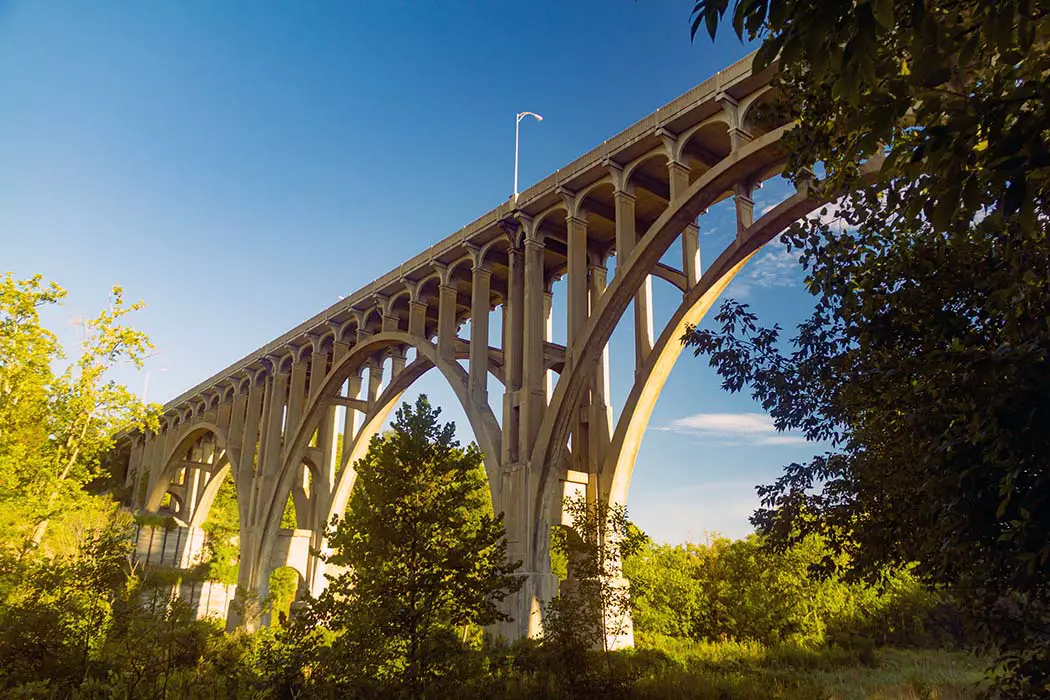 Arch bridge spanning a river. Best Places to Photograph Cuyahoga Valley National Park