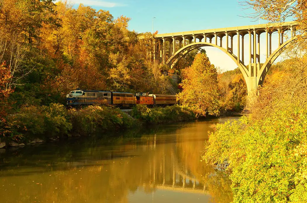 Cuyahoga Valley Scenic Railroad train under bridge overpass. Best Places to Photograph Cuyahoga Valley National Park