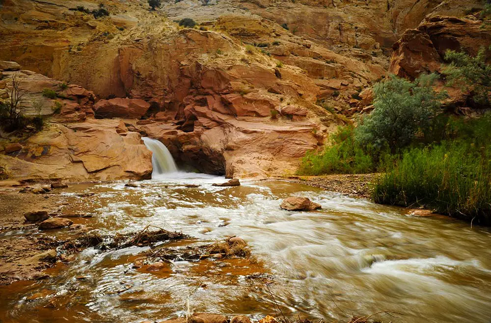 Fremont River waterfall on the east side of Capital Reef National Park. Best Photography Spots in Capitol Reef National Park