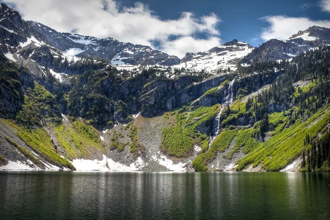 Rainy Lake and waterfall in the North Cascades. The best Photography spots in North Cascades National Park
