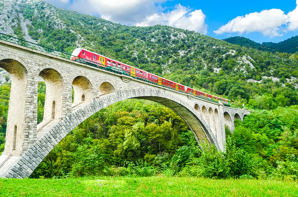 Solkan Bridge Slovenia with train passing. The best Photography spots in Slovenia