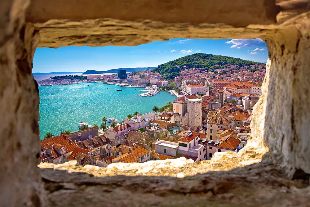 Split bay aerial view through stone window.The best Photography spots in Croatia