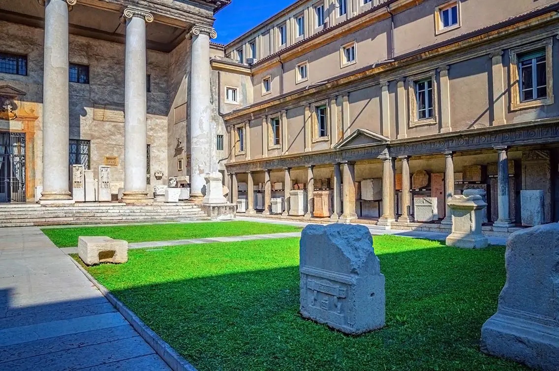Courtyard with ancient Roman Empire ruins and green lawn. Best Photography Spots in Verona