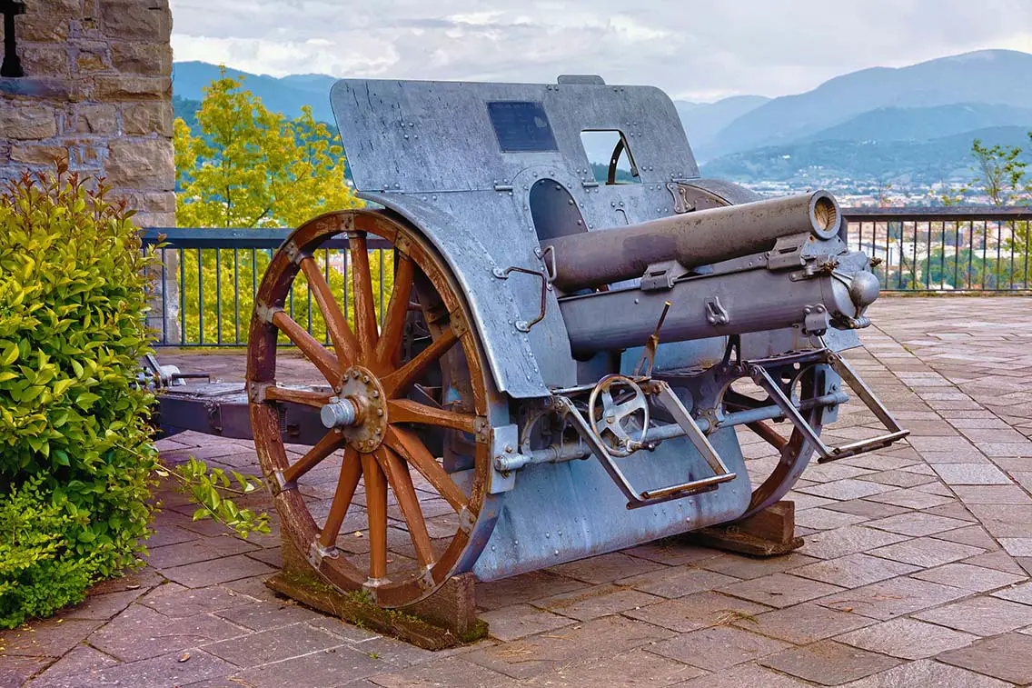 Old cannon weapon Obice da 100 17 M. 14 Skoda 1914 in the park of the Fortress of Bergamo. Best Photography Spots in Bergamo