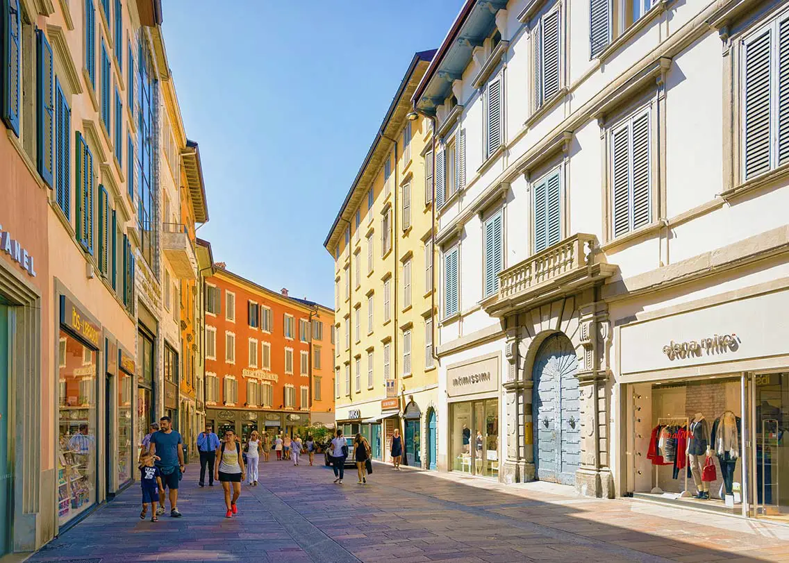 People on Via XX Settembre Street in Bergamo Italy. Best Photography Spots in Bergamo