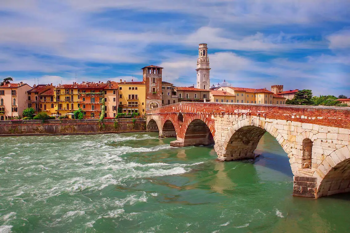 Ponte Pietra an old arch bridge in Verona northern Italy. Crosses Adige river. Best Photography Spots in Verona