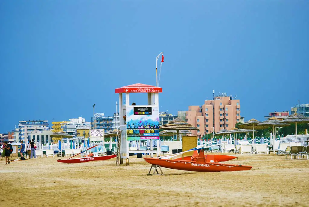 Rescue tower and boats on the beach of Marina Centro on a cloudy. Best Photography Spots in Rimini