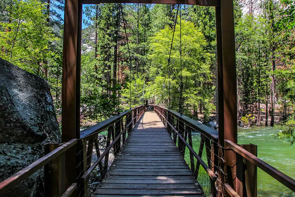 Wooden bridge over the raging River into the forest in s Canyon National Park