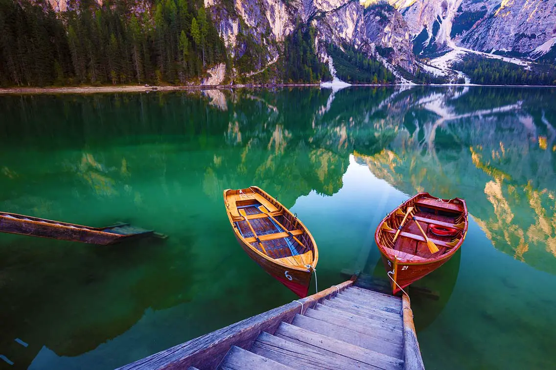 Boats on the Braies Lake Pragser Wildsee in Dolomites. Best Natural Wonders in Italy