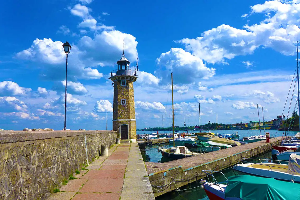 Lighthouse in the town of Desenzano del Garda on Lake Garda. Best Photography spots in Lake Garda