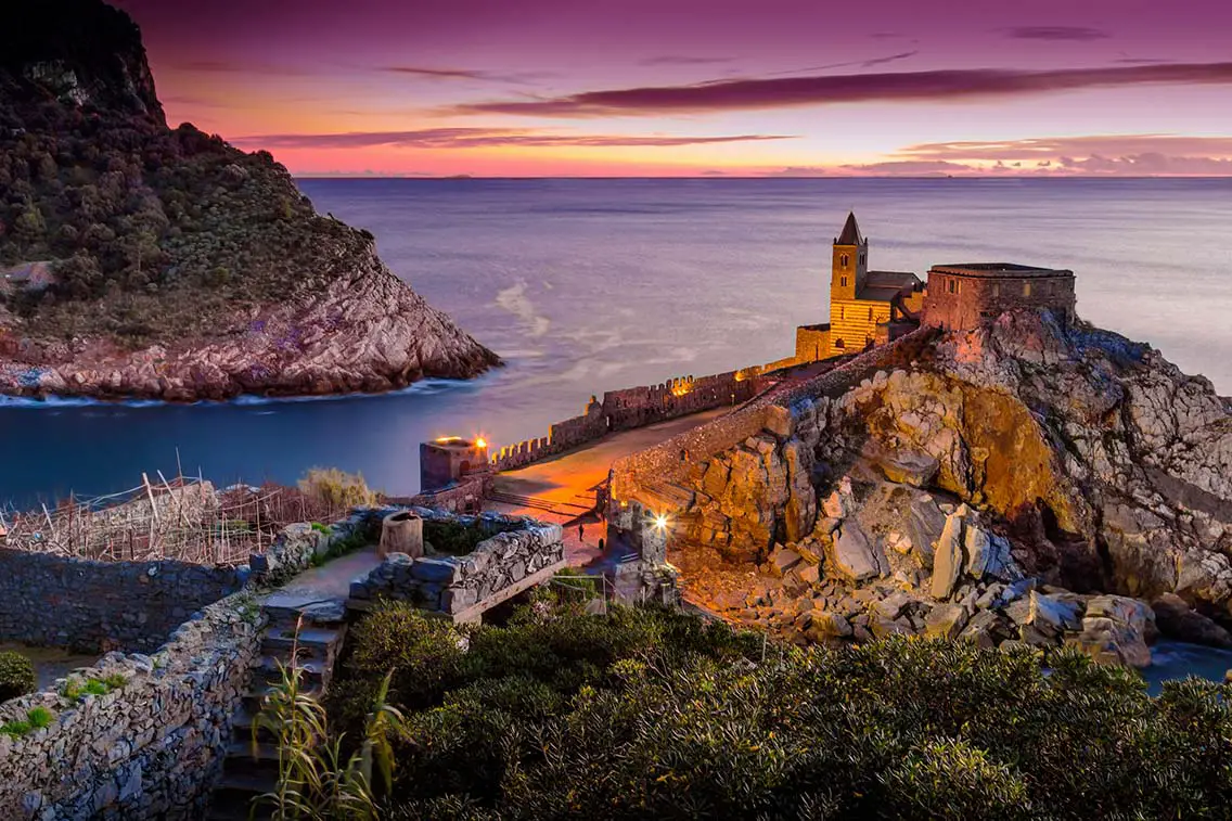Night view of the church of St. Peter at sunset in Porto Venere Liguria Italy. Best Natural Wonders in Italy