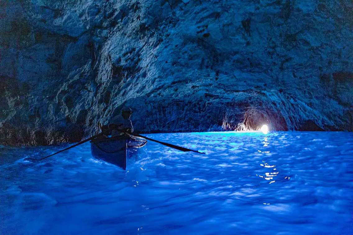 Paddle boat in the Blue Grotto on the Island of Capri Italy. Best Natural Wonders in Italy