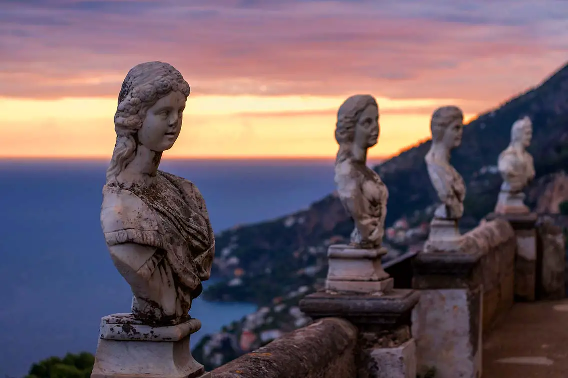 View of the famous statues and the Mediterranean Sea from the Terrace of Infinity. Best Photography Spots in Amalfi Coast