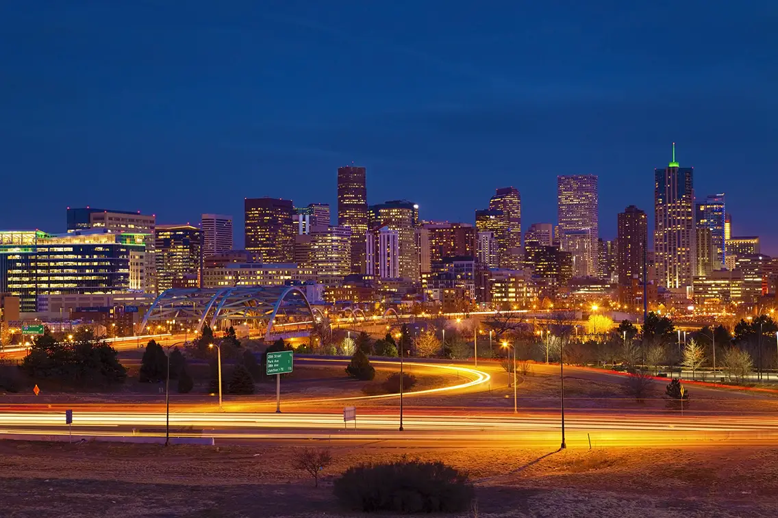 Image of Denver Skyline and busy highway in the foreground. Best cities for photography in the USA